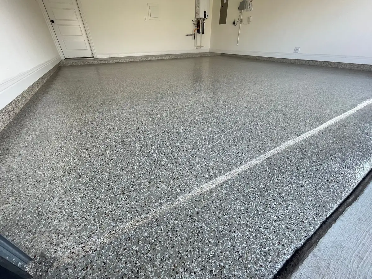 A garage floor with a lot of small stones on it.